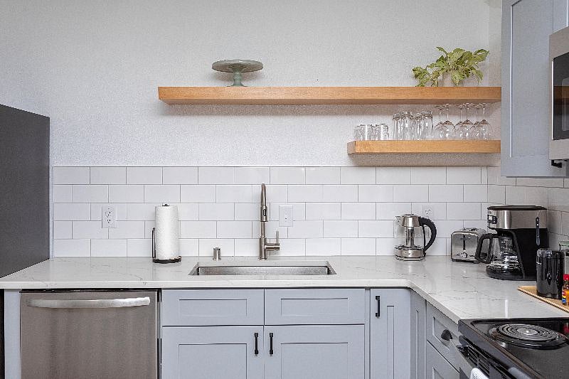 Deep basin sink and quartz countertops