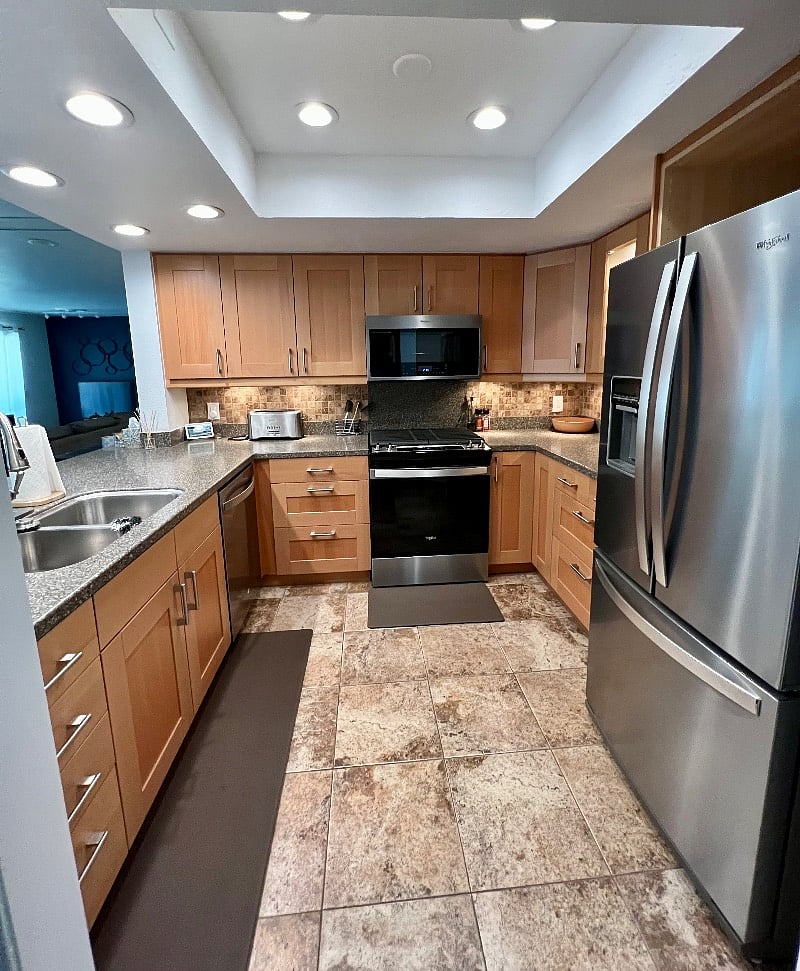 The kitchen features brand new stainless steel Whirlpool appliances.