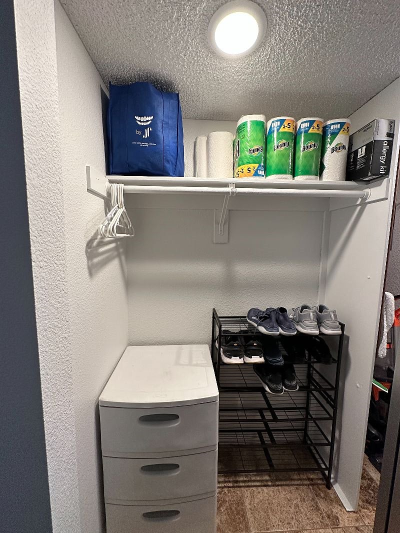 The entry closet has ample storage space for coats and shoes.
