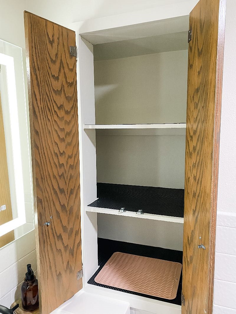 Lots of storage in the bathroom and a heat-safe mat for all your hair tools. Hair dryer included.