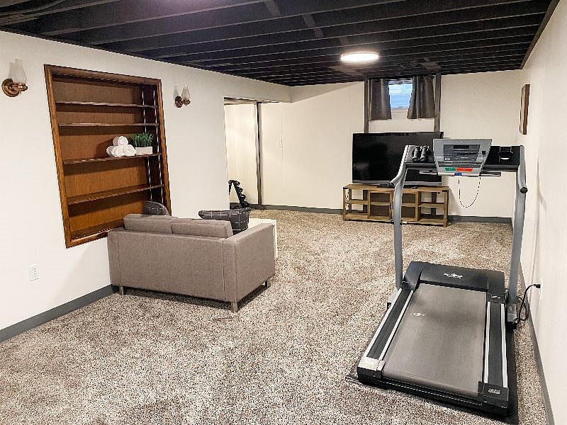 Second living area and exercise space in basement