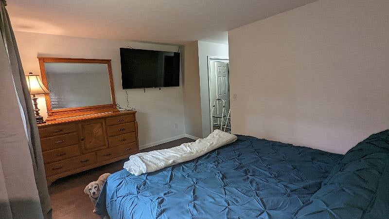 Primary bedroom, king bed. 65" TV
