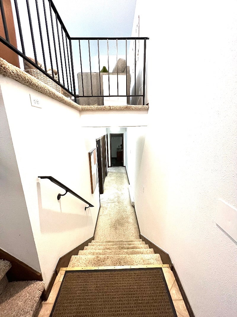 Stairs to the bedrooms, laundry and full bath