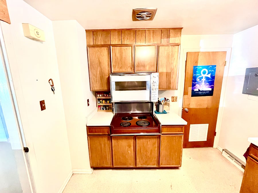 Washing machine, stove, oven, microwave in this mid-century modern kitchen makes it a chef's delight.