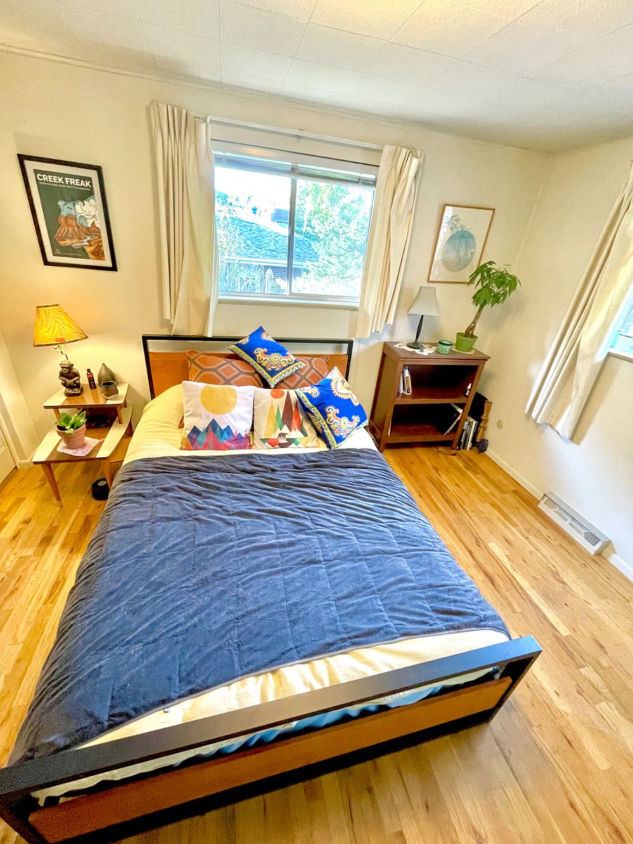 Master bedroom with a queen bed, great south and west facing windows to bring in natural light.