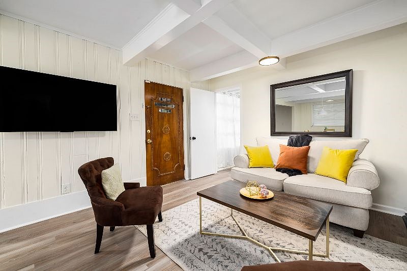 55" smart TV - wall mount swivels towards living room or dining room