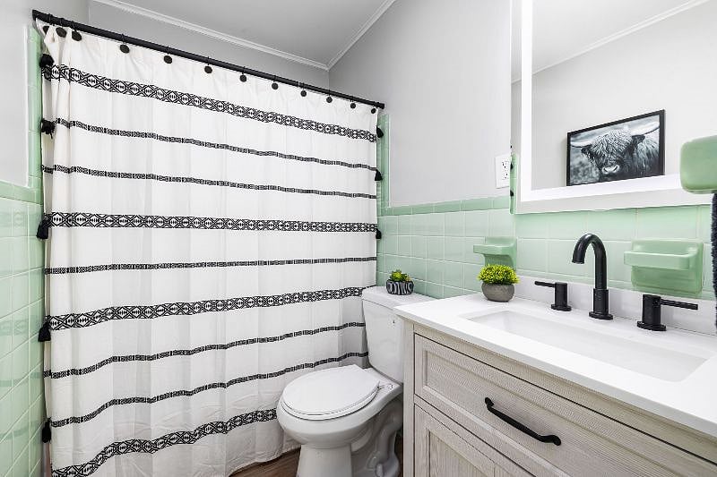 Chic earthy feel - full bath with Vintage Mid century elements.