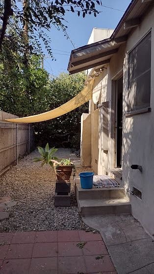 back yard access to garage to the washer & Dryer
