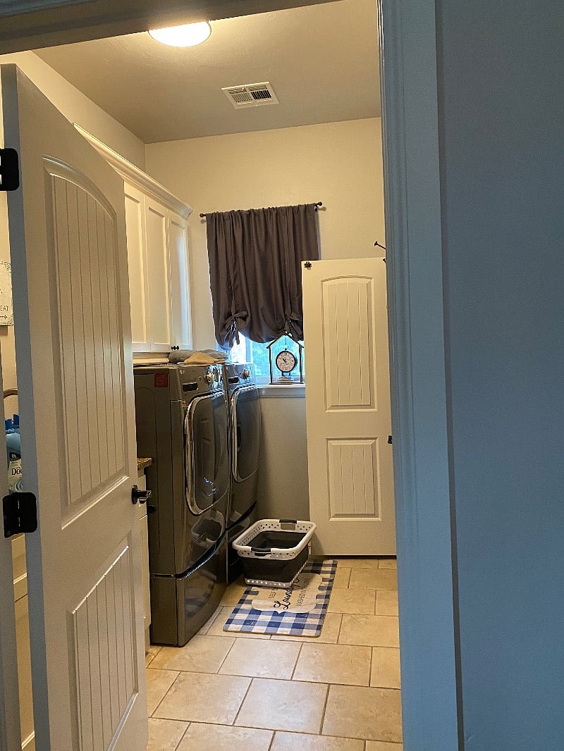 At the bottom of the stairs, extra capacity, extra large washer and dryer 2 years old.