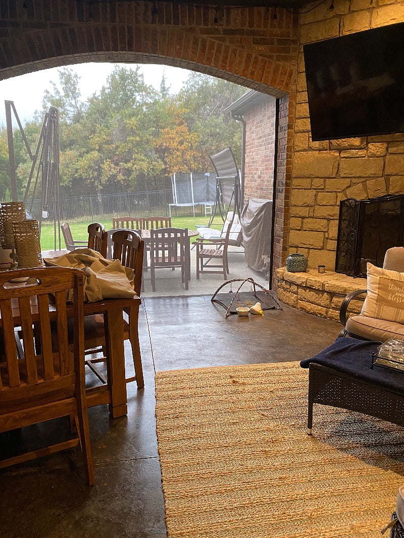 Close to the door to porch also and we have firewood and a gas grill, outside the screen.
Table and glider, two comfy chairs with ottoman.
Heavy screen by remote keeps it secured and a glider and table also on the outside in the spring and summer has a 10 ft. umbrella that lights up.