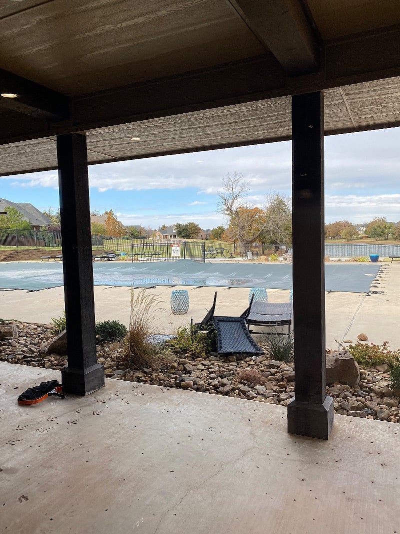 Clubhouse pool and chairs tables for picnic with grill pool closed for winter now.