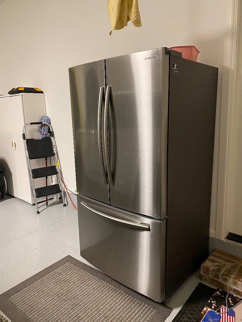 Additional refrigerator in the garage.