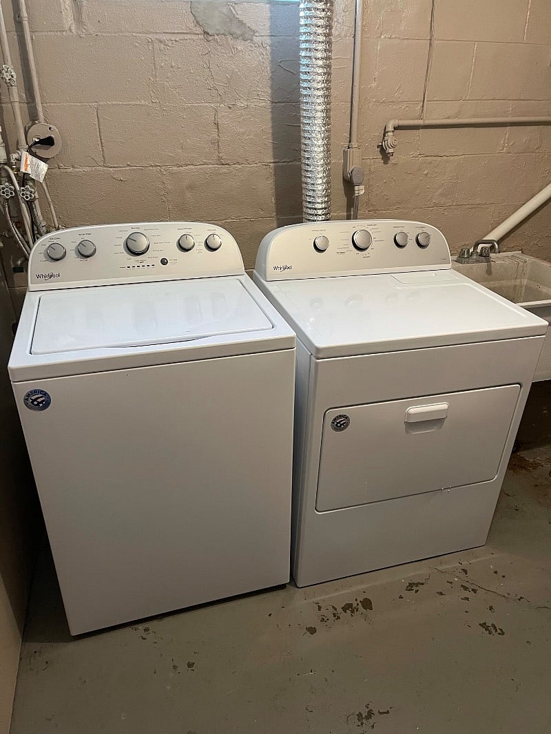 Washer and dryer in basement.