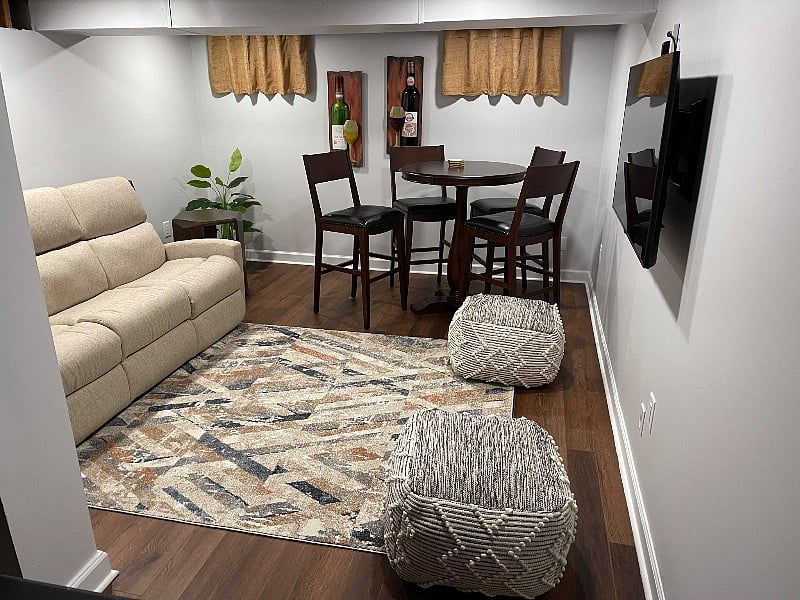 Partially furnished basement that can be used as an entertainment room.