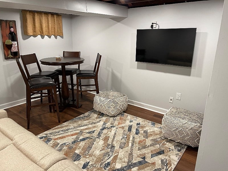 Partially furnished basement that can be used as an entertainment room.