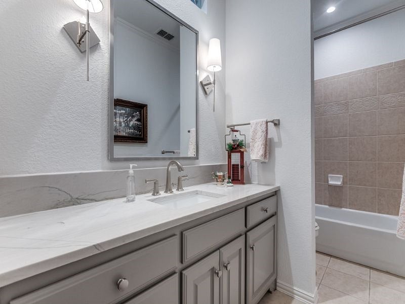 This is your private bathroom with new quartzite countertop, new fixtures and freshly painted. Enjoy instant hot water at the sink and shower. Plenty of space for all bathroom essentials.