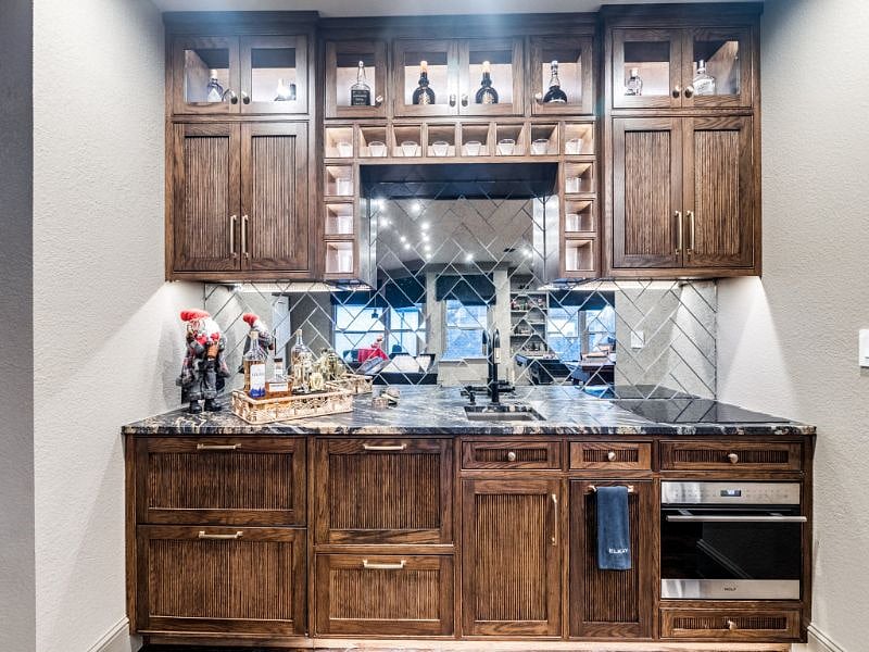 The Wet Bar - Brand new beautiful wet bar with reeded doors and Quartzite countertop.
