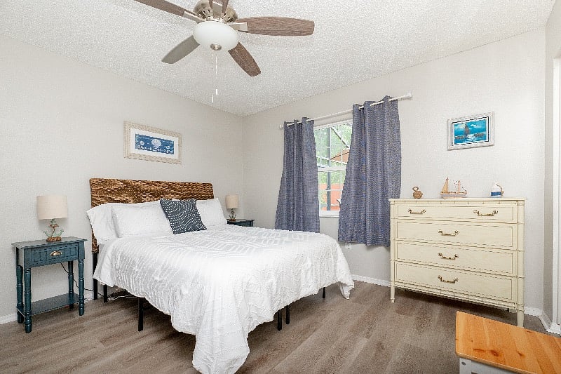 Master bedroom with comfortable queen size mattress and black out window treatment.