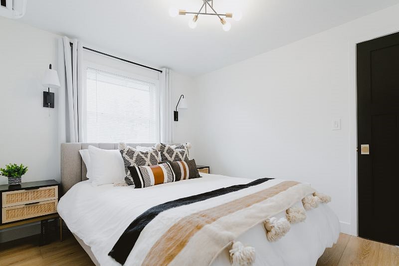 Guest Bedroom #1 with a Casper Hybrid Queen Mattress, blackout curtains, mini split (to control room temperature with heat and A/C) and smaller walk-in closet.