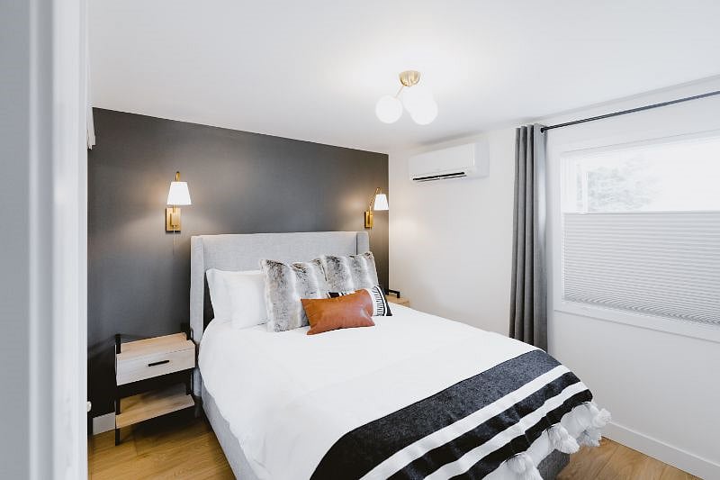 Guest Bedroom #2 with a Winkbed Hybrid Luxury Firm Queen Mattress, blackout curtains, mini split (to control room temperature with heat and A/C) and mirrored closet with built-in storage.