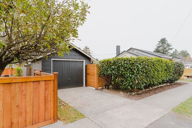 This is the detached driveway that can fit a smaller SUV or Car. If you go thru the gate to the right you will enter the backyard and go to the left to the detached room or thru the back mudroom door to enter the home.
