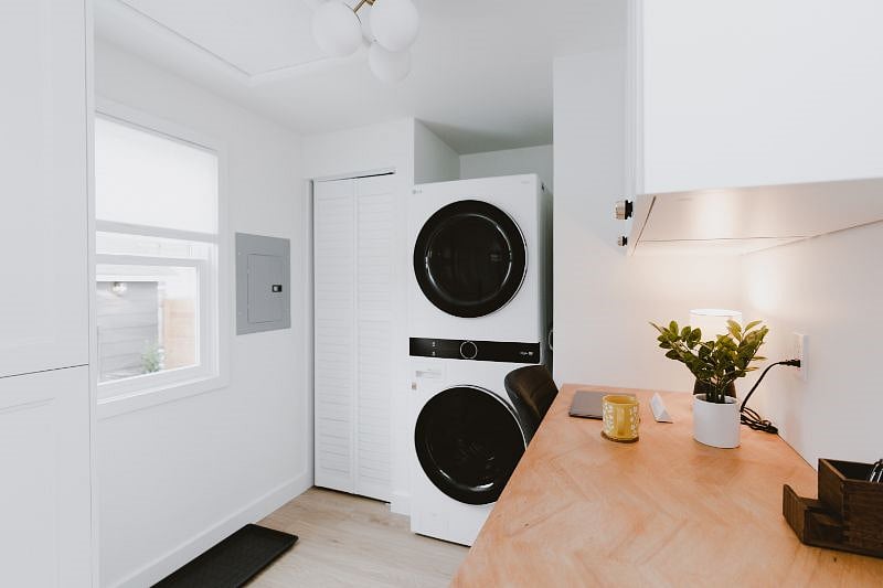 Full size washer and dryer with built-in desk area (or laundry folding station).