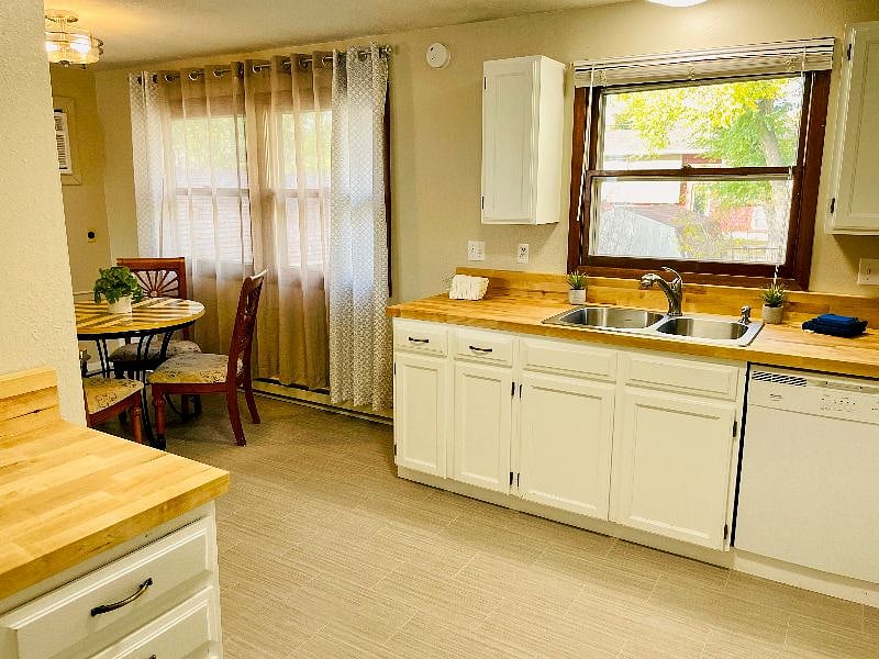 Fully stocked kitchen with brand new counters, sink, and fixtures.