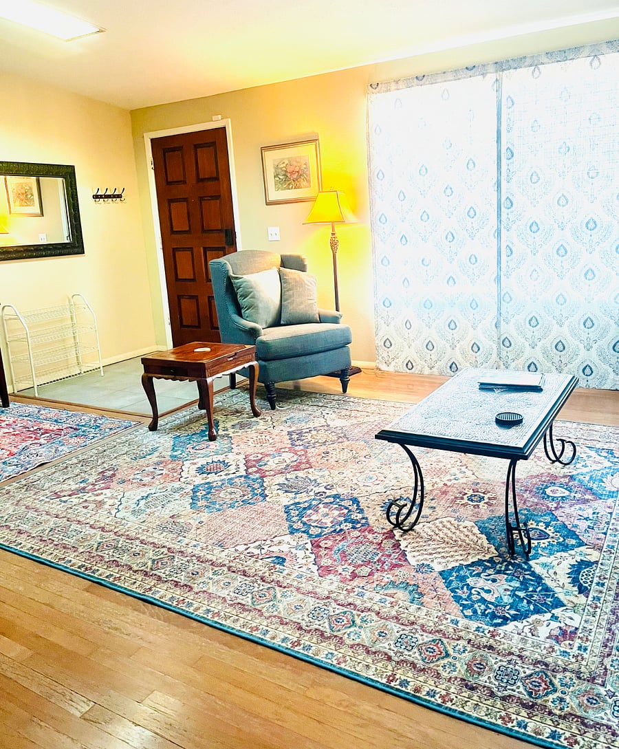 Front entrance and north-facing window in living room area