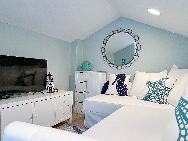 The loft has another smart tv and comfortable couch to relax.