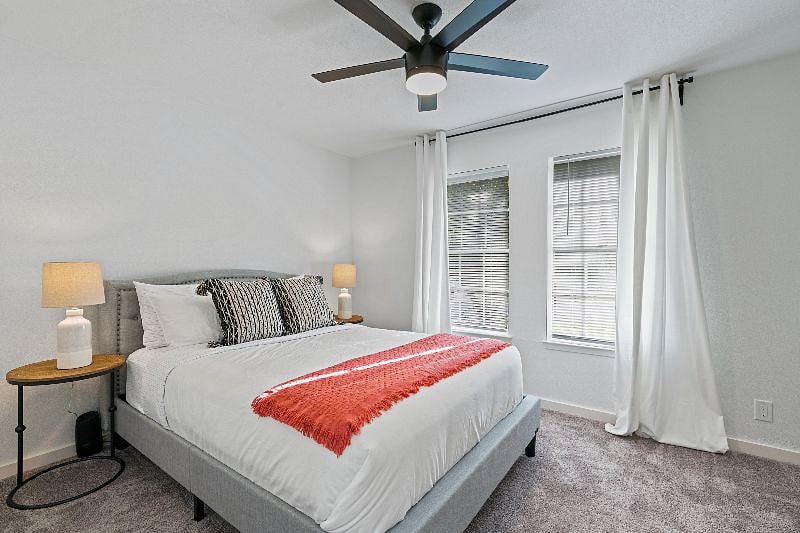 The third bedroom offers a queen, luxury-rated mattress and light-blocking curtains for a comfortable and restful stay.
