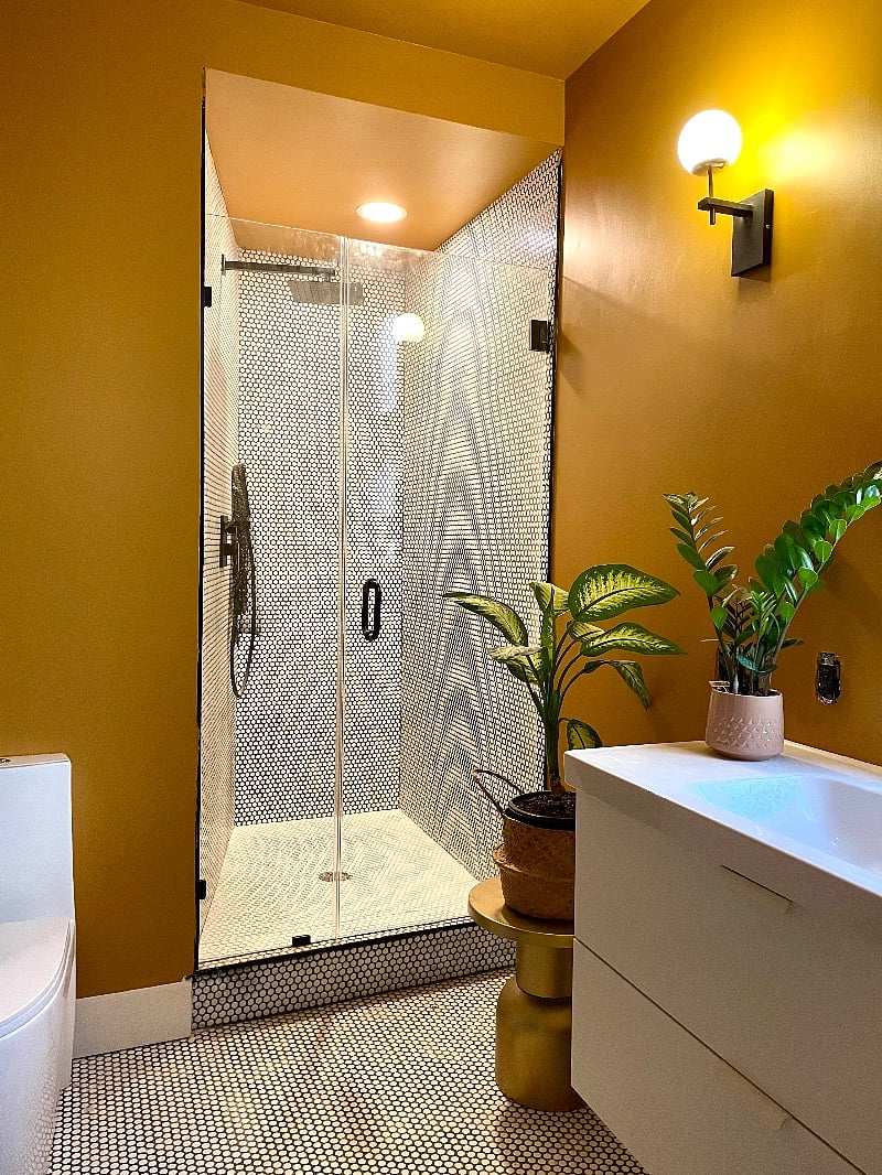 Bathroom with floating vanity and rain shower head