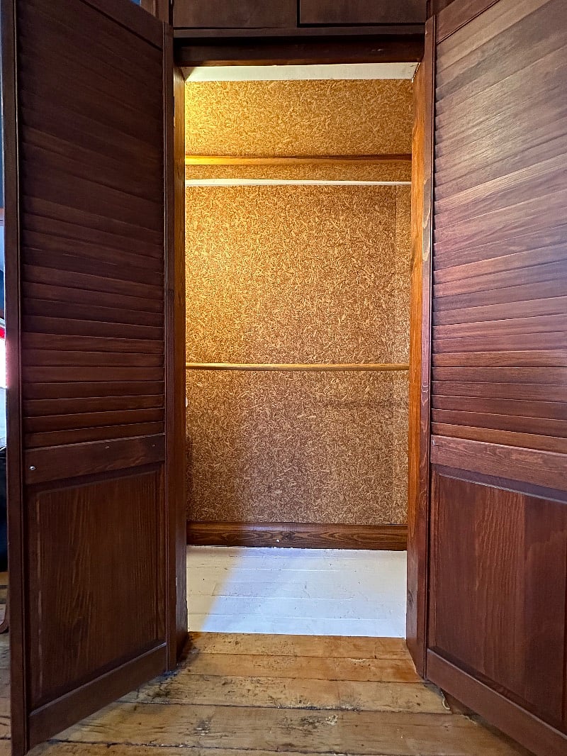 The closet on the right has two rods for hangers, so youll have plenty of space to hang up clothing. There are a bunch of hangers in this closet.