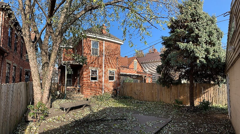 Private, fenced-in back yard with a deck and plenty of shade