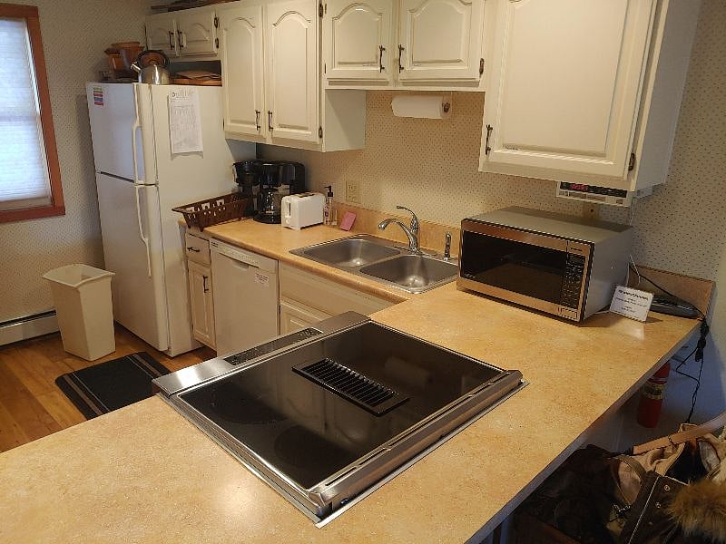New refrigerator, new downdraft electric range, new quiet dishwasher.