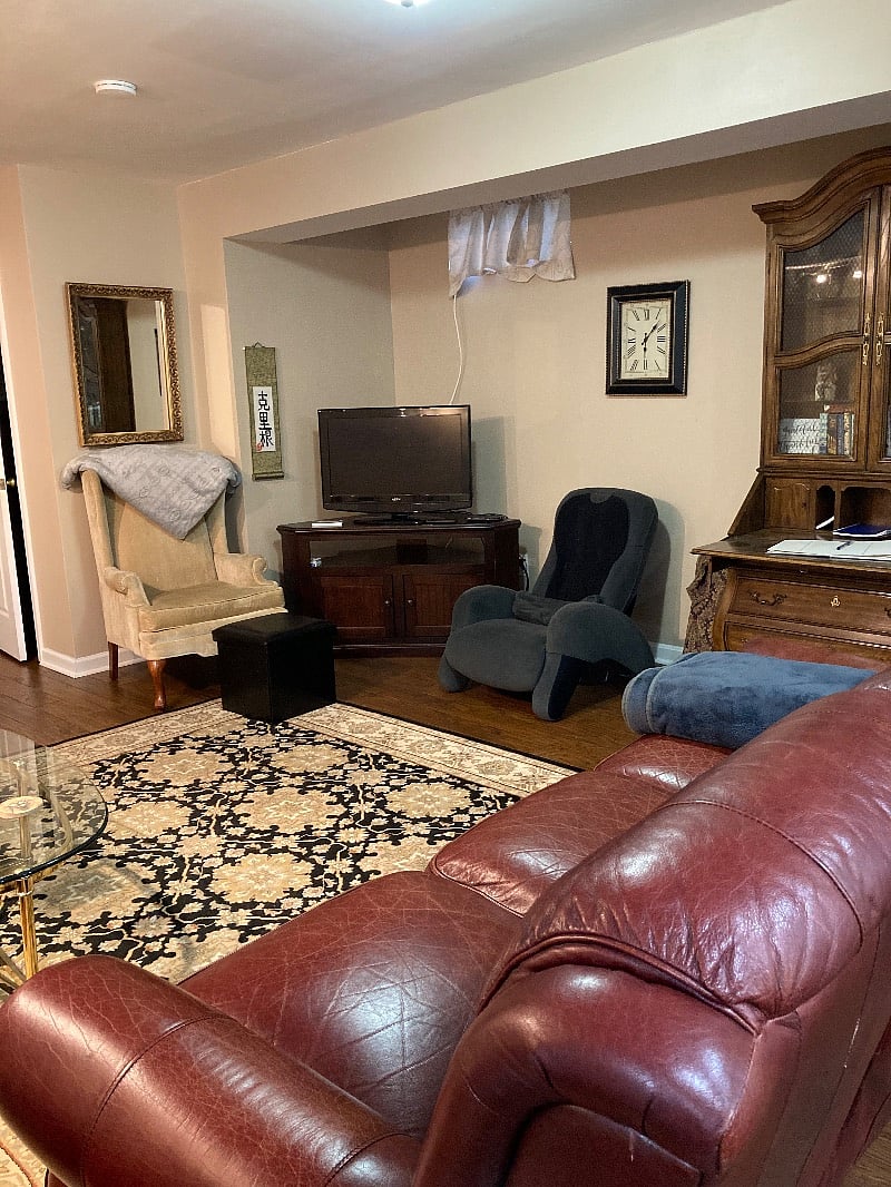 Very comfortable living space with massage chair and fold-out desk/secretary cabinet