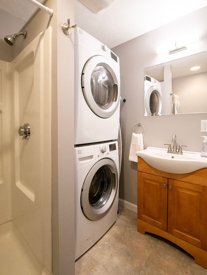 Smaller full sized bathroom with laundry