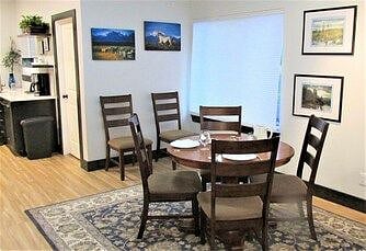 Dining area can seat up to six people (by adding table from desk area).