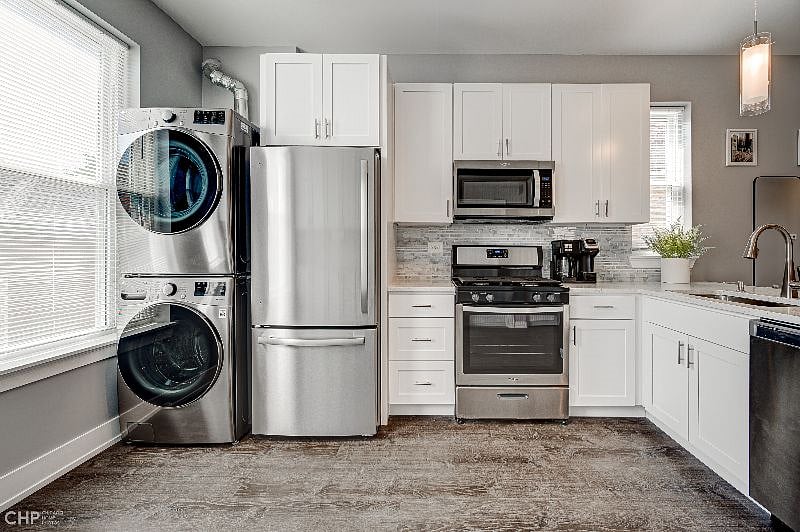 Enjoy convenience of in-unit washer and dryer. Kitchen is fully stocked with basics and essentials.