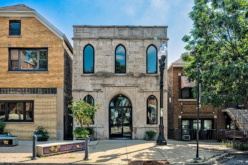 Unique and beautiful gothic style front facade. Building originally built in 1882 and operated as a funeral home for over a century. Full renovation completed in 2022. Currently a real estate office in the front commercial space.