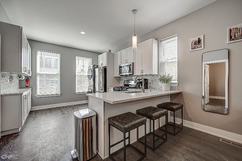 Kitchen with large peninsula bar