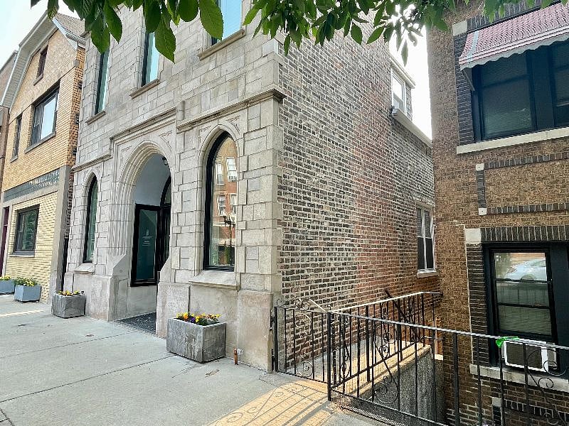 Guest apartment is accessed through the walkway along side of building.