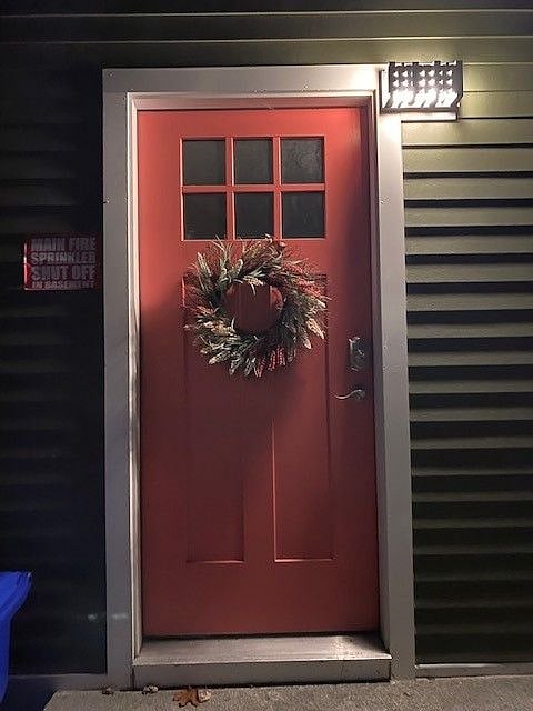 Side door to home and outdoor entrance to the apartment.