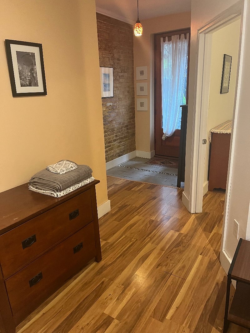 Large entryway with shoe cabinet and large entry closet.