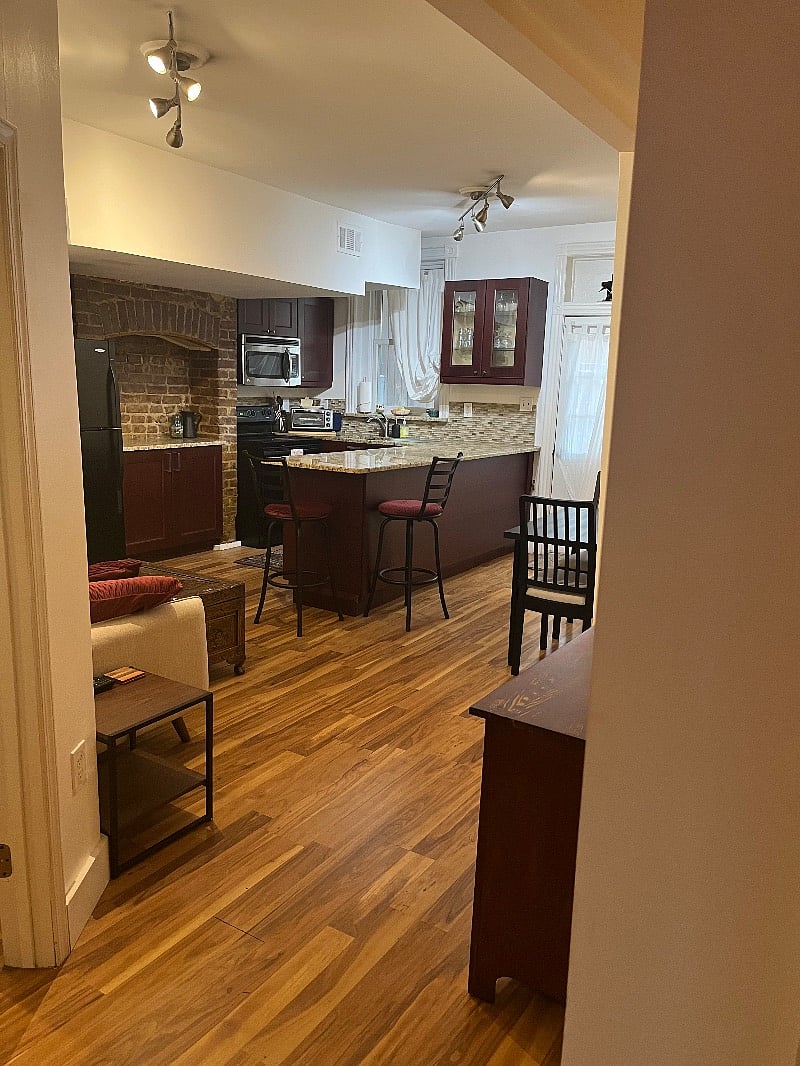 Open concept living area with entertainer's kitchen, dining area, and sitting area.