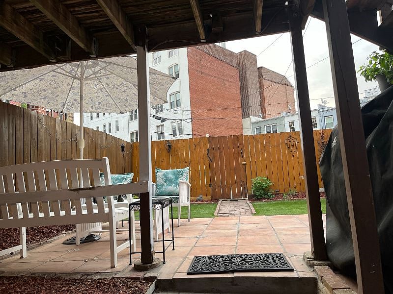 Direct access to fenced backyard and parking spaces outside fence.  Fence and patio were replaced in 2023.