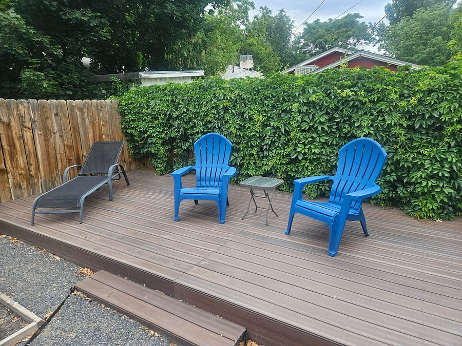 Sunny rear deck in shared backyard
