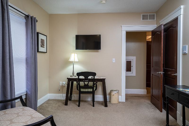 Quite study area, with desk and chair within your bedroom.