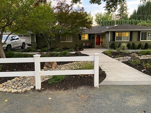 Homeowner's home. Private parking and renter entrance to left of home. Unit is on left back half of property