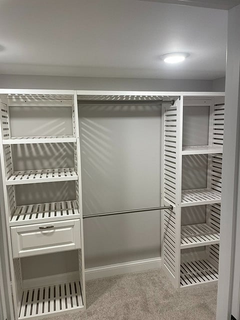 New walk in closet with closet organizer.