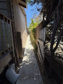 lower walkway from street leading to private gated walkway to front of cottage.